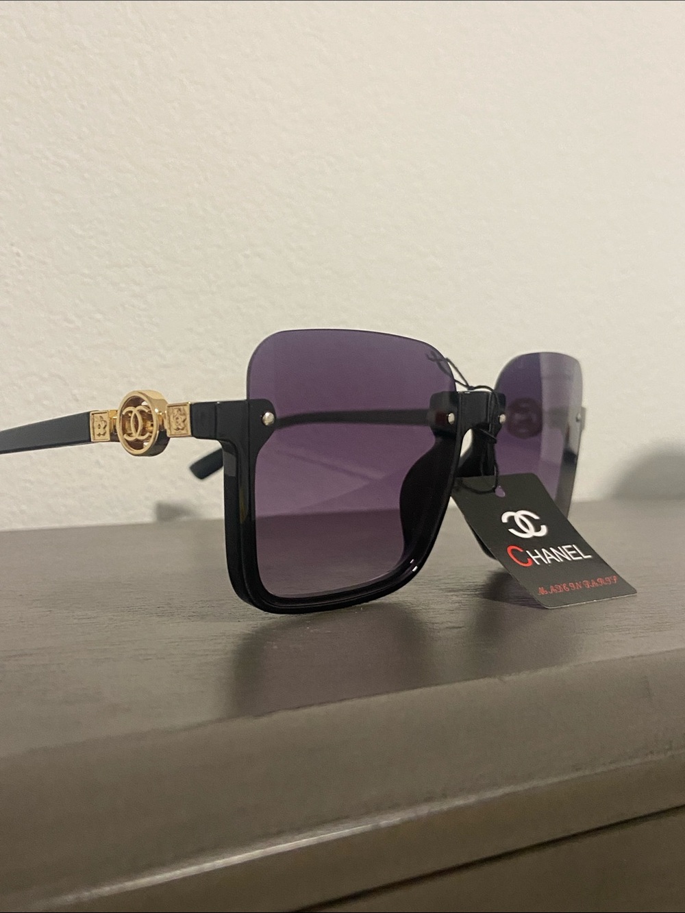 Black Frame Sunglasses with Purple Gradient Lenses and Gold Temples